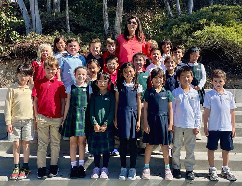 Three smiling students at Del Mar Pines