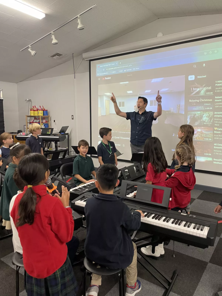 DMP students practicing a song in music class